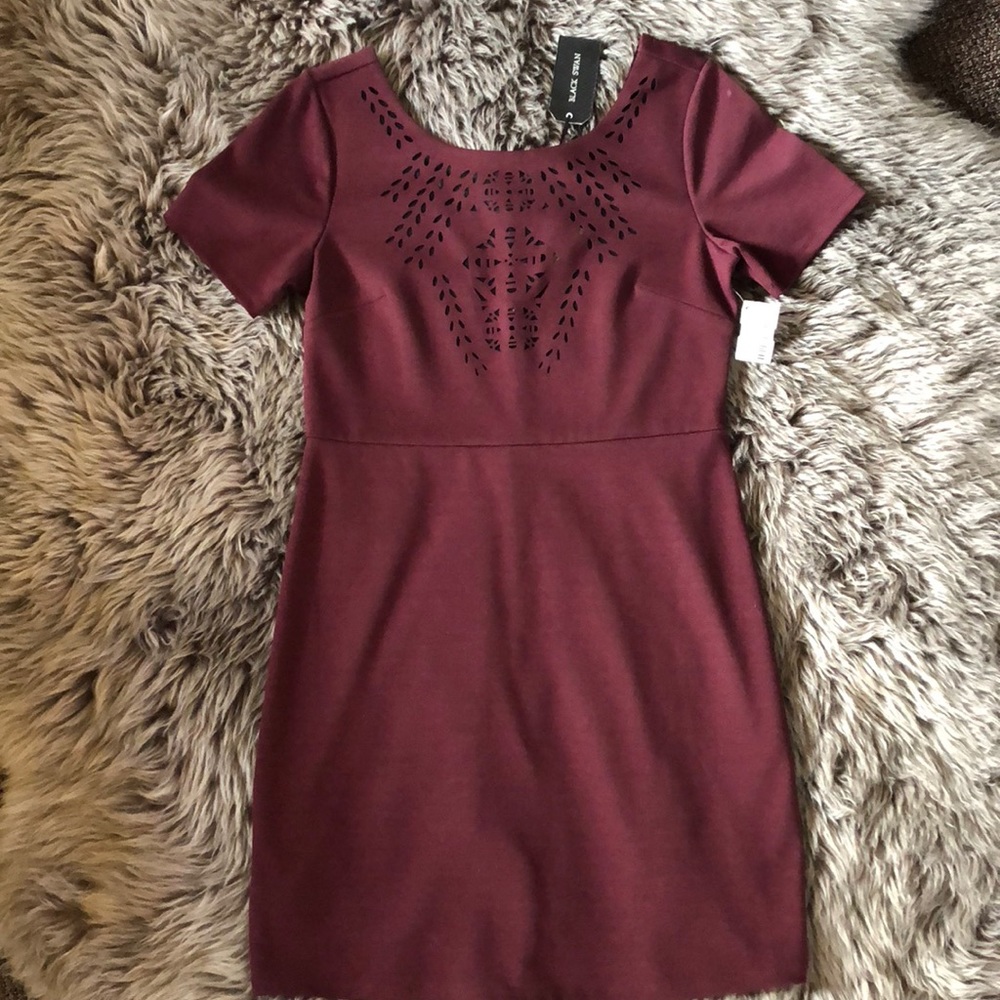 Burgundy laser cut fitted dress.